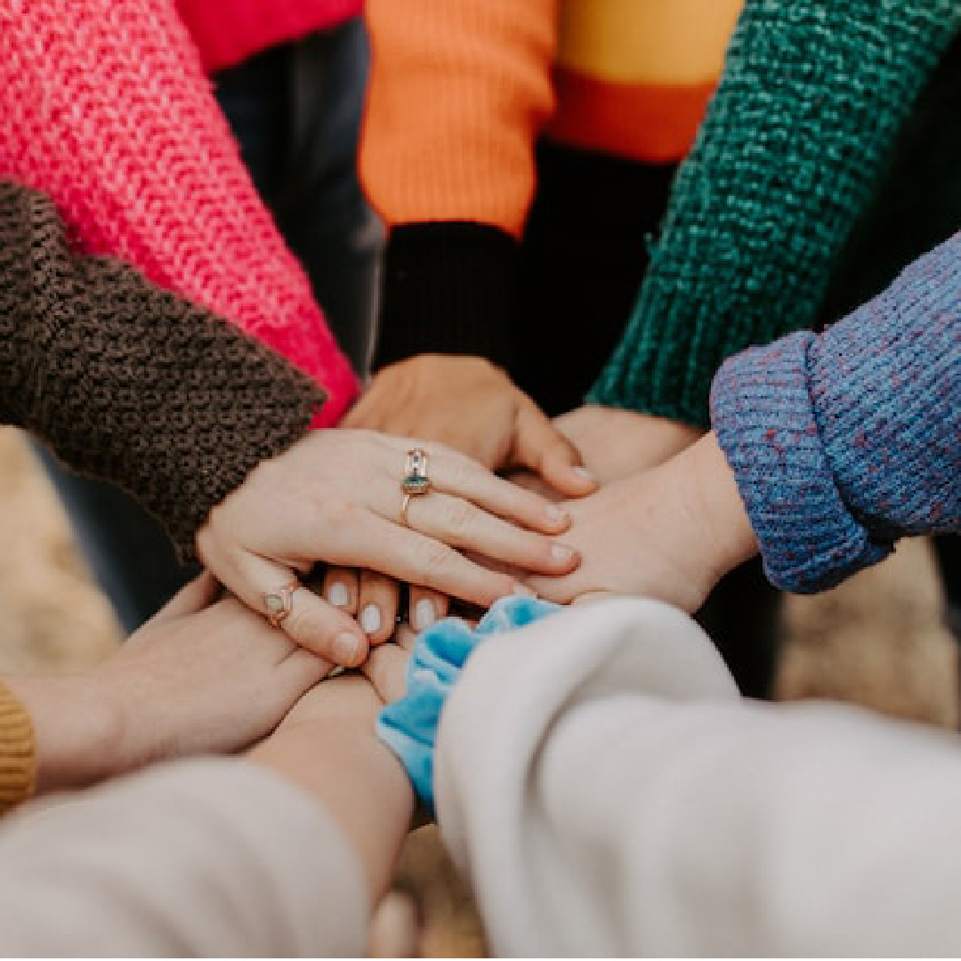 Group of hands in the middle cheering